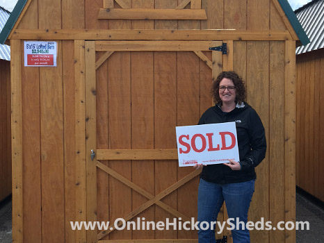 A woman happy with her new Hickory Shed